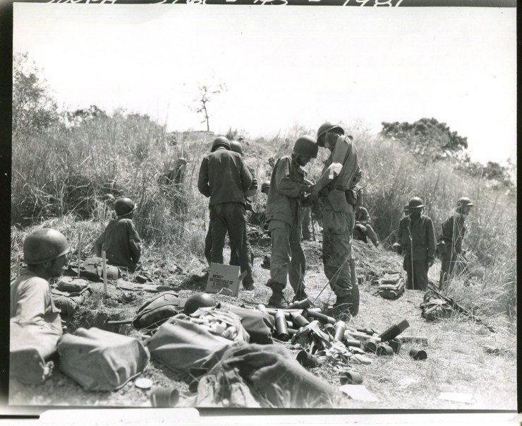 Medics taking care of the wounded during the last attack on Mt. Tanuan (Photo courtesy NARA)