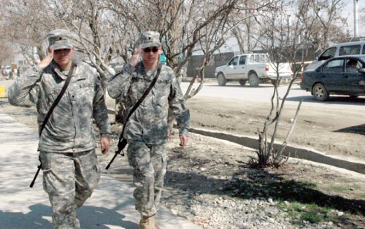 Soldiers saluting on Disney Drive, Bagram Air Base, 2005 (Photo credit Stars and Stripes)