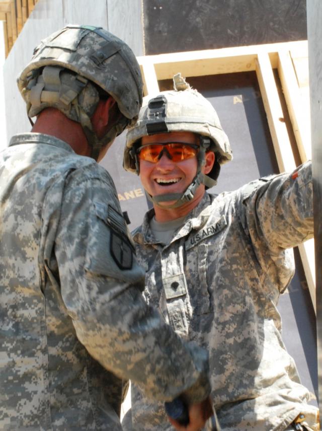 Spc. Jason Rhodes laughes with a fellow Company B, 46th Engineer Combat Battalion (Heavy) / U.S. Army Photo by Sgt. Rebekah Malone